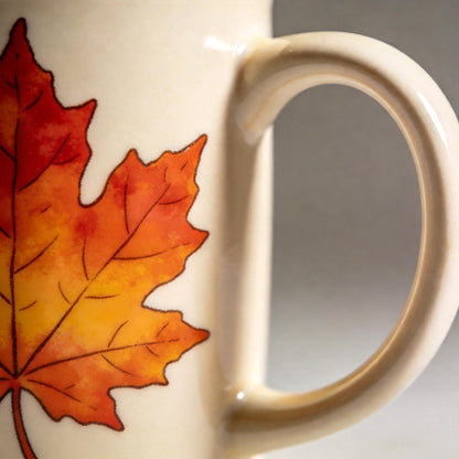 Fall Maple Leaf Ceramic Mug – Cream Coffee Cup with Red, Orange & Golden Autumn Artwork for Cozy Mornings, Reading Corners & Seasonal Gifting