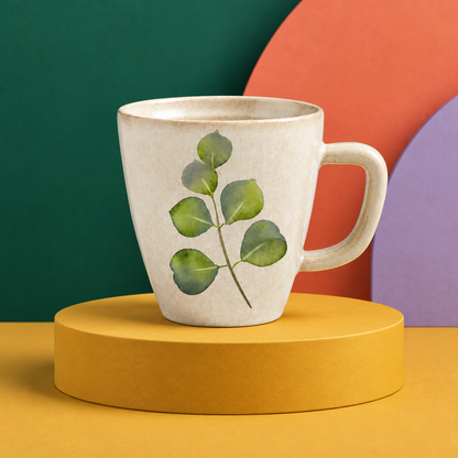 Cream botanical mug against a vivid emerald coral and lavender studio backdrop