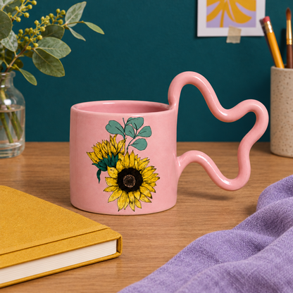 Pink sunflower mug concept on a colorful creative desk