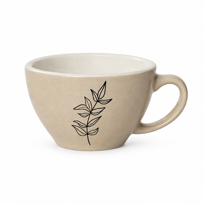 Beige wide-bowl coffee cup with black leaf line art on white background